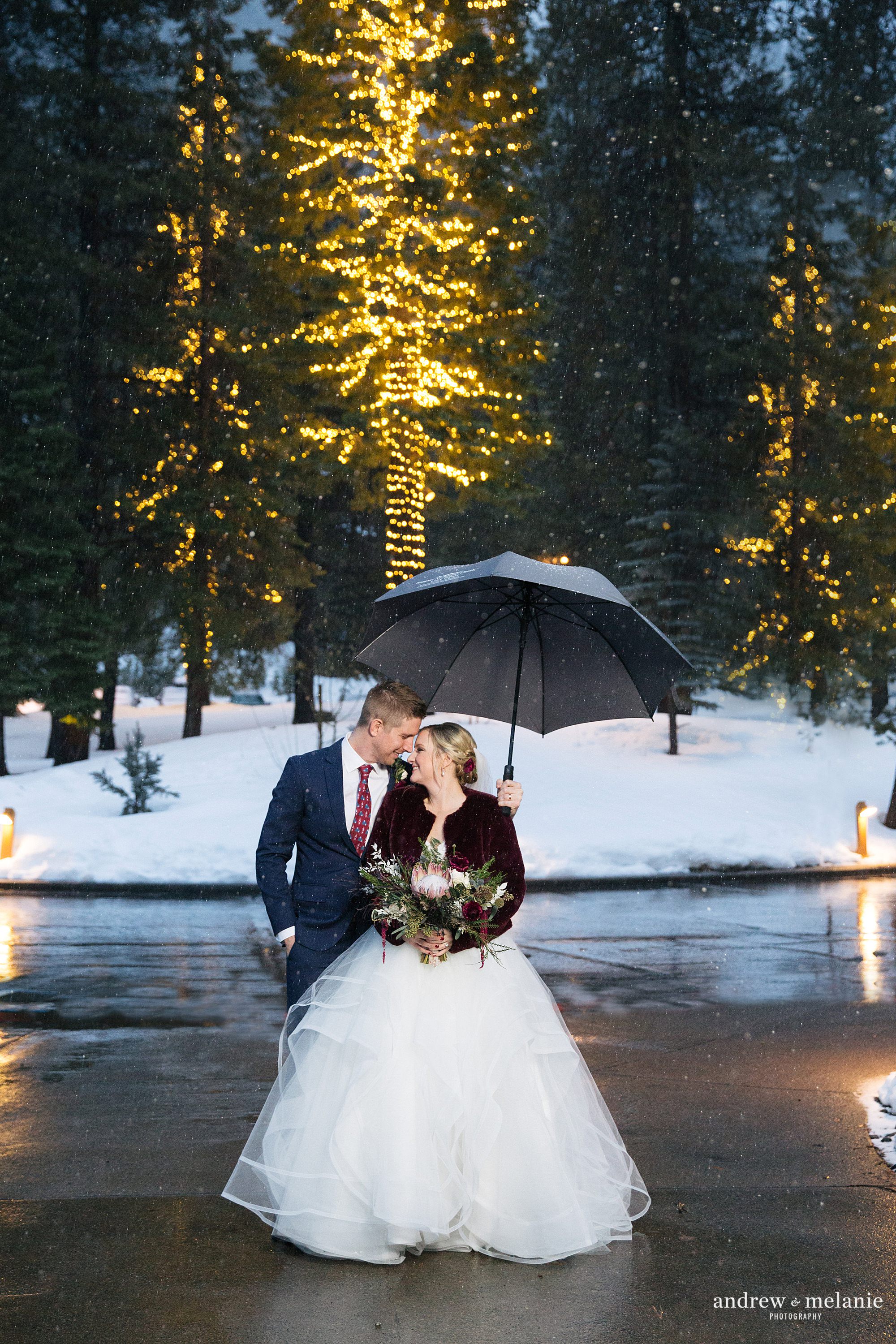 Bride and groom on snowy rainy day at squaw valley resort lake tahoe