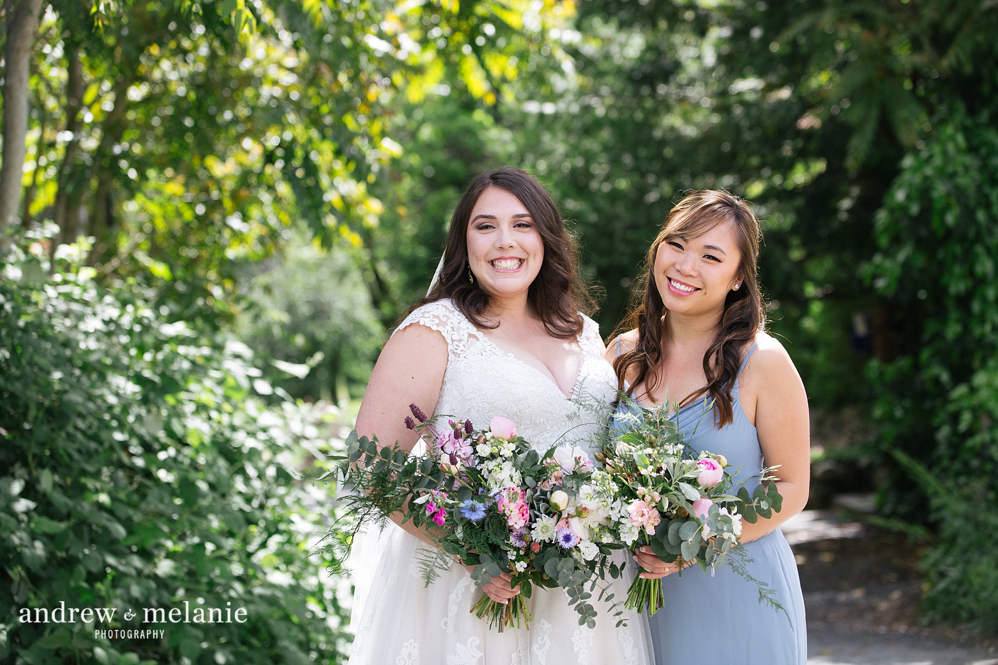 bride with bridesmaids in blue dresses at Miner's Foundry Nevada City, CA